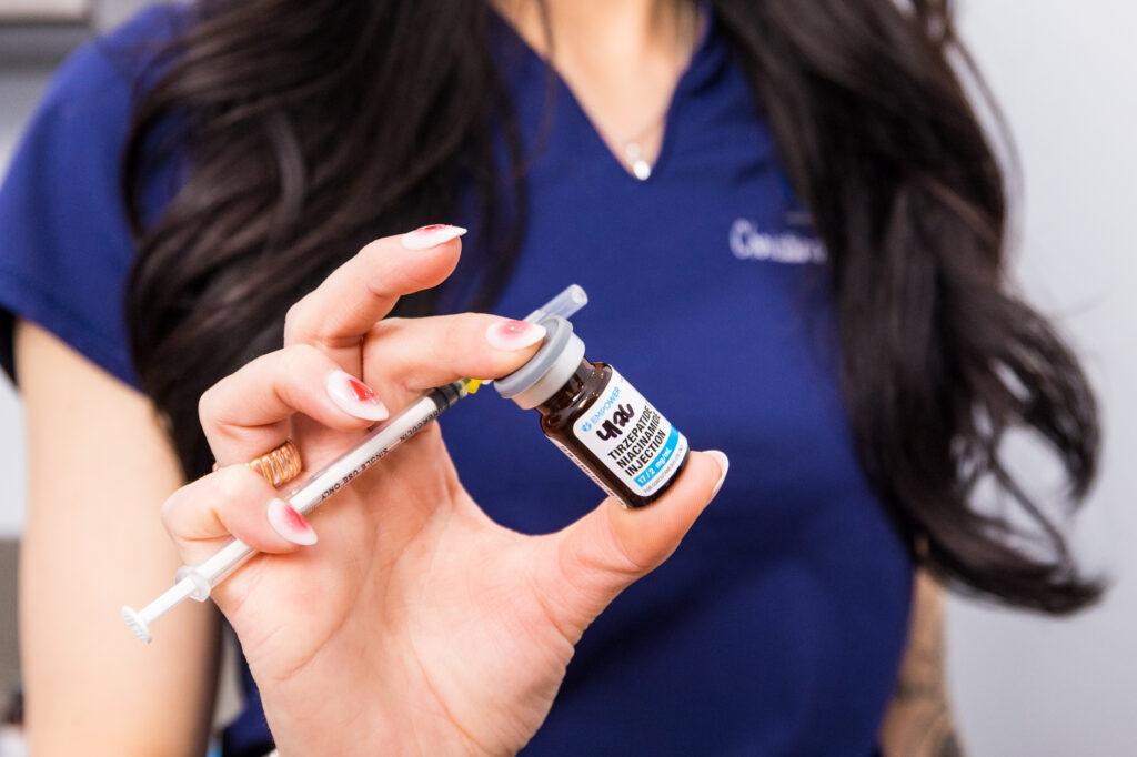 A close-up of a provider holding a medication vial used for weight loss in Nashville.